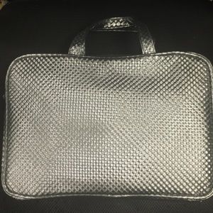 Silver travel toiletries bag